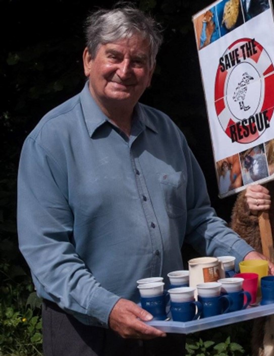 Aubrey Ingleton, upper body, carrying a tray of coffee.